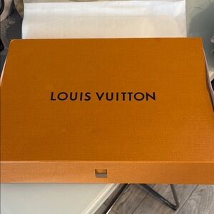 Louis Vuitton Signature Orange Box and a blue LV ribbon
